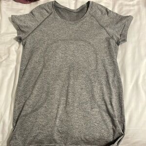 Lululemon swiftly tech size 8 in grey! Hip length.